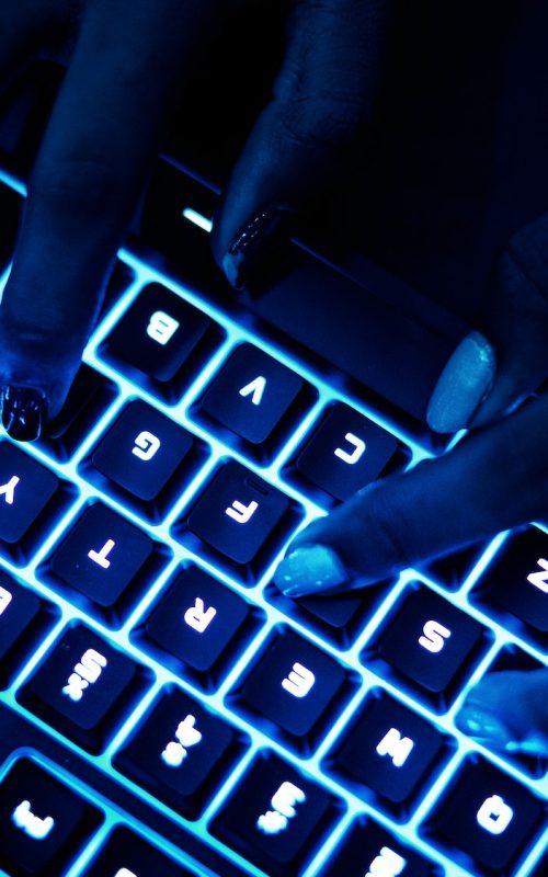 Closeup of hands using a keyboard